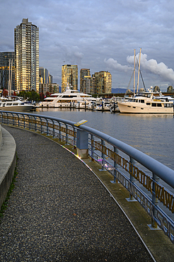 False Creek pedestrian waterfront in Autumn, Yaletown Neighbourhood, Downtown Vancouver, British Columbia, Canada