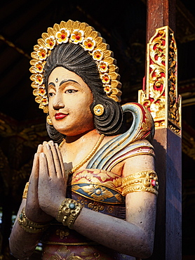 Carved women praying, detail on house, Ubud, Bali, Indonesia, Southeast Asia, Asia