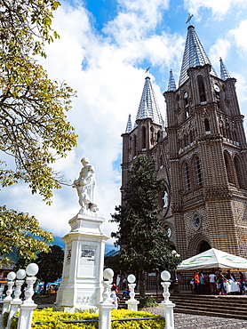 Basilica Menor de la Immaculada Concepcion faces the Parque Principal and a monument to women, Jardin, Colombia, South America