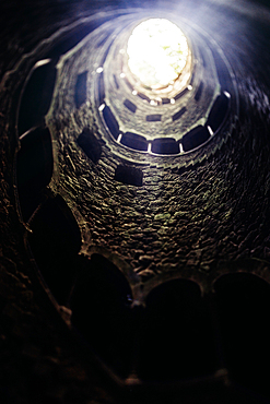 View of spiral staircases at the Initiation Well, purportedly used for ceremonial purposes by Freemasons in the 19th century, at Quinta da Regaleira, Sintra, Portugal, Europe