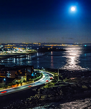 Aerial view of the super full moon overlooking the Tagus River in Lisbon, Portugal