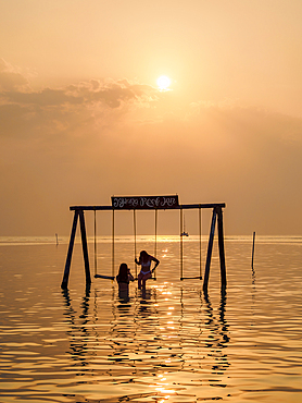 Swing at the Stingray Beach, sunset, Caye Caulker, Belize District, Belize