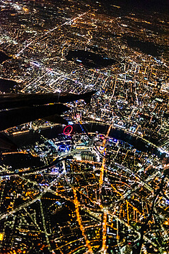 View over London at night from an airplane window, London, England, United Kingdom, Europe