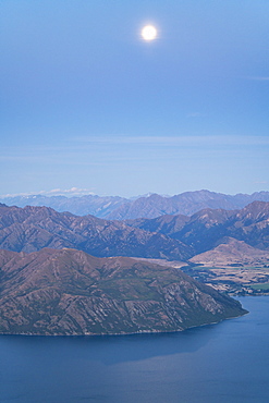 Moonlight over Lake Wanaka and Mount Aspiring National Park at sunset, Wanaka, Queenstown Lakes district, Otago region, South Island, New Zealand, Pacific