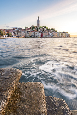 The old town at sunset, in summer, with stone steps in the foreground, Rovinj, Istria county, Croatia, Europe