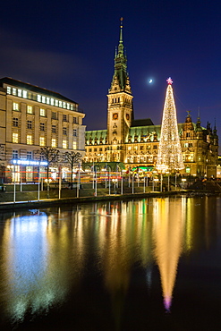 Reflection of Hamburg's Town Hall (Rathaus) and Christmas Market at blue hour, Hamburg, Germany, Europe