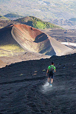 hiker trekking on mount Etna