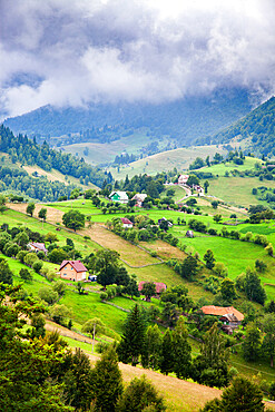 Rural landscape of Magura village, 1000 metres up in the mountains, in the Piatra Craiului National Park, Romania, Europe