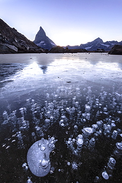 Frozen Riffelsee lake by Matterhorn in Switzerland, Europe