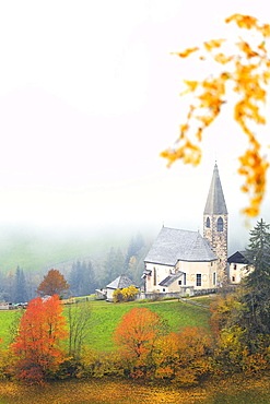 Church of Santa Magdalena in the autumn mist, Funes Valley, Sudtirol (South Tyrol), Dolomites, Italy, Europe