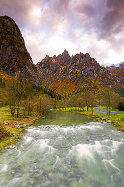 Torrent surmounted by mountains at sunrise, Valmasino, Valtellina, Lombardy, Italy, Europe