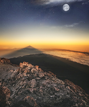 View of El Teide volcano shadow and full moon from the summit right before the sunrise, El Teide National Park, UNESCO World Heritage Site, Tenerife, Canary Islands, Spain, Atlantic, Europe