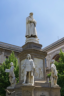 Leonardo da Vinci statue with his disciples at his feet in Piazza della Scala, Milan, Lombardy, Italy, Europe