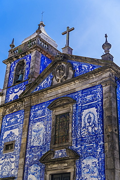 Facade of Chapel of Souls, covered with azulejo blue and white painted ceramic tiles, Capela das Almas Church, Porto, Portugal, Europe