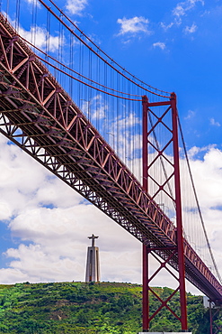 Ponte 25 de Abril Bridge with Cristo Rei statue (Christ the King Sanctuary) behind, suspension bridge over the Tagus River, Lisbon, Portugal, Europe