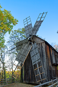 Historic windmill exhibited as part of a traditional Romanian village life inside Dimitrie Gusti National Village Museum, Bucharest, Romania, Europe