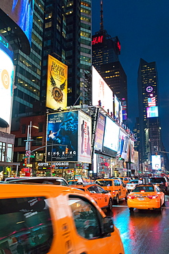 Yellow taxis in Times Square at night. New York City, New York, United States of America, North America