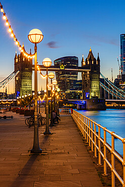 View of Tower Bridge and City of London at sunset, from Shad Thames, London, England, United Kingdom, Europe