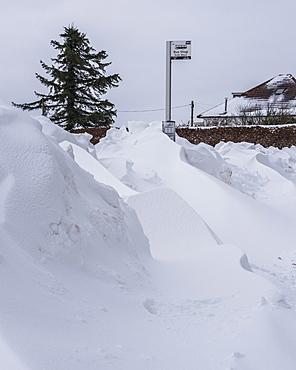 Snow drifts at a bus stop on the edge of Lennoxtown, at the foot of the Campsie Fells, East Dunbartonshire, Scotland, United Kingdom, Europe