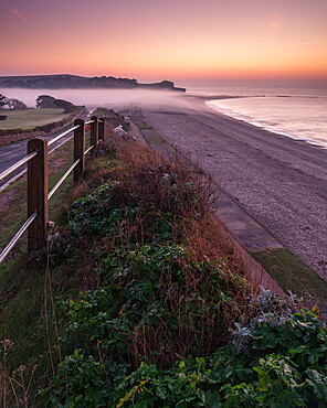 Winter twilight and heavy band of mist from River Otter at Budleigh Salterton, Devon, England, United Kingdom, Europe