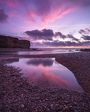 Dawn clouds at mouth of River Otter at Budleigh Salterton, Devon, England, United Kingdom, Europe