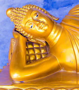 A gold Buddha in saiyat posture at the Big Buddha complex (The Great Buddha) in Phuket, Thailand, Southeast Asia, Asia