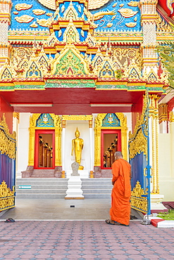 A monk at Mongkol Nimit temple (Wat) in Phuket old town, Phuket, Thailand, Southeast Asia, Asia