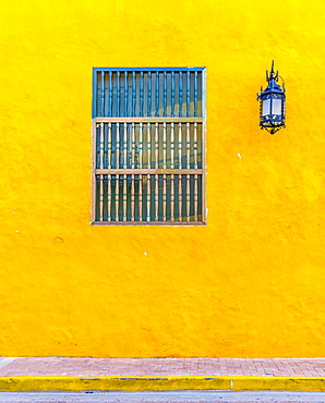 The facade of a colourful traditional building in the old town in Cartagena de Indias, Colombia, South America