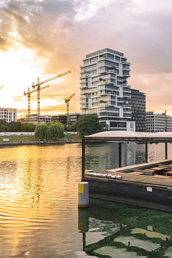 View of the Spree River after sunrise in Berlin with modern buildings on the background, Berlin, Germany, Europe