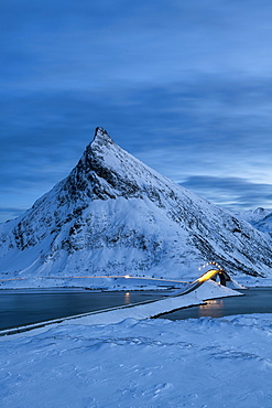 Fredvang Bridge set against pyramid shaped mountain at night with light trails, Lofoten, Arctic, Norway, Europe