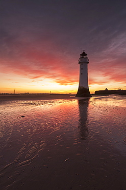 Dramatic sunrise at Perch Rock Lighthouse, New Brighton, Merseyside, The Wirral, England, United Kingdom, Europe