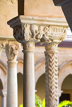 Columns with finely carved capitals in cloister of the Arab-Norman cathedral, UNESCO World Heritage Site, Cefalu, Palermo, Sicily, Italy, Mediterranean, Europe