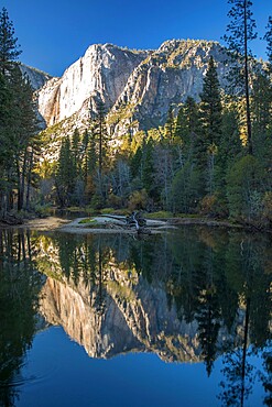 High granite cliffs reflected in the tranquil Merced River, autumn, Yosemite Village, Yosemite National Park, UNESCO World Heritage Site, California, United States of America, North America