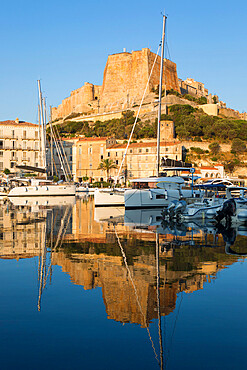 View across harbour to the citadel, sunrise, the Bastion de l'Etendard prominent, Bonifacio, Corse-du-Sud, Corsica, France, Mediterranean, Europe