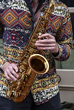 Saxophone player on a Bourbon Street corner in the French Quarter of New Orleans, Louisiana, United States of America, North America