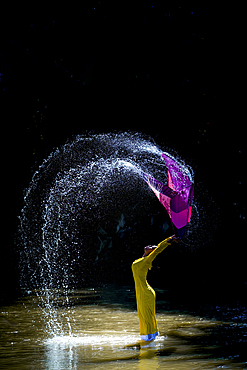 The girl washes her scarf and dances in the stream, Vietnam, Indochina, Southeast Asia, Asia