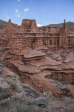 Kok-Moinok Canyon, a clay-sand structure formed on the slopes of arid mountains cut by water streams, Kyrgyzstan, Central Asia, Asia