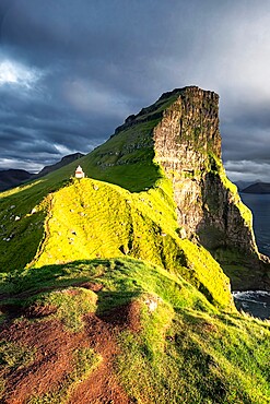 Sunset on Kallur Lighthouse on Kalsoy island, Faroe Islands, Denmark, Europe