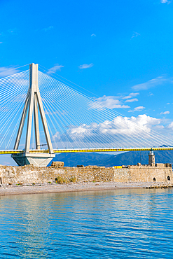 Charilaos Trikoupis Rio Antirrio Bridge and Antirrio lighthouse seen from a ferry boat crossing to Peloponnese, in Greece