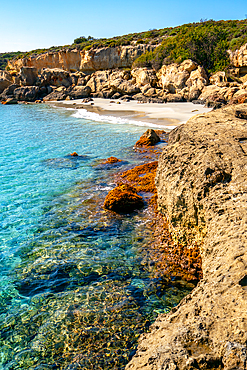 Petrified forest Agia Marina Agios Nikolaos Geopark beach with turquoise water in the south of Greece