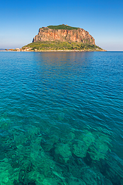 Monemvasia historic city on an island with a mountain in the middle of turquoise sea water, in Greece