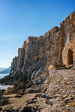 Monemvasia island historic city castle near the turquoise sea water, in Greece