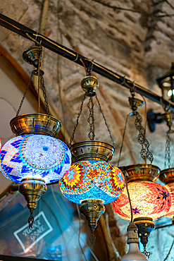 Turkish traditional colorful mosaic lamp chandeliers on a bazaar market in Izmir, Turkey