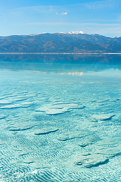 Salda lake with stromatolites in the turquoise water on a sunny day in Turkey