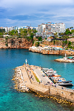 Antalya city and port view with boats in the marina in turquoise water in Turkey