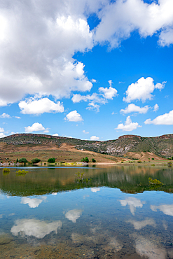 Akkoy dam lake landscape with perfect reflection on the water in Cappadocia, Turkey