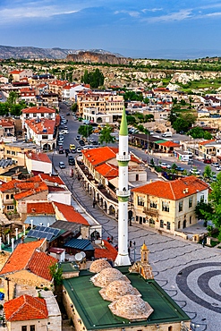 Ortahisar city with traditional houses and mosque seen from the castle in Cappadocia, Turkey
