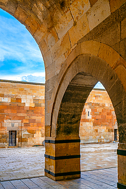 Stone arches inside Saruhan Caravanserai medieval lodge in Cappadocia, Turkey