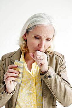 Elderly person taking medication