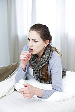 Woman coughing.